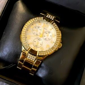 GUESS gold and rhinestones watch with white face